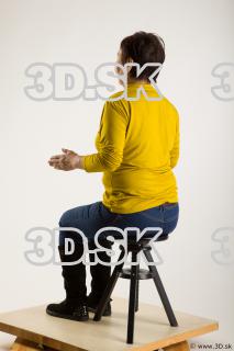 Sitting reference of yellow sweater blue jeans Gwendolyn 0010